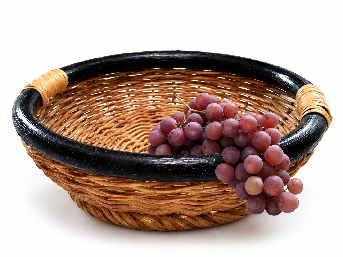 Wicker basket with purple grapes
